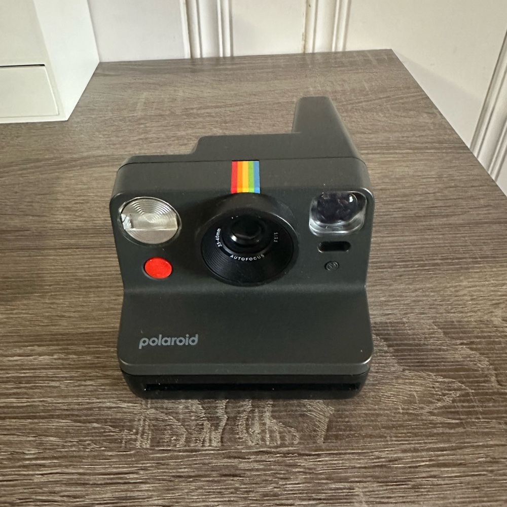 Polaroid Camera and 2 sets of film